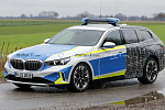 Компания BMW замаскировала электрическую 5 Series под полицейскую машину 