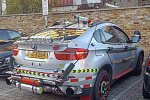 Владелец этого BMW X6 решил очень странно украсить свое авто 