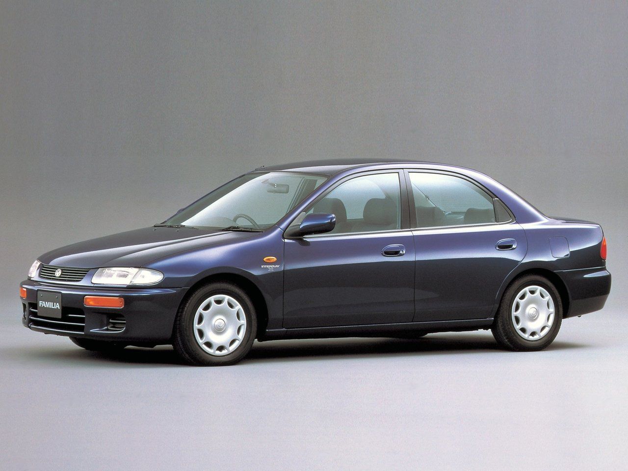 Mazda 323 V (BA) 1994 – 2000 Седан: кузов, класс, тип и объём двигателя,  коробка передач, разгон, фото - CarsWeek.ru